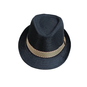 Detailed view of black woven straw fedora hat featuring a colorful striped ribbon band