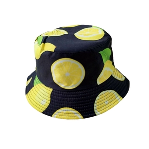 Close-up of a navy blue bucket hat featuring bright yellow lemon print patterns