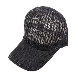 Detailed macro view of black knitted hollow baseball cap with sparkling rhinestone accents