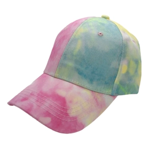 Detailed view of tie-dye baseball cap featuring pastel pink, blue and yellow gradient fabric