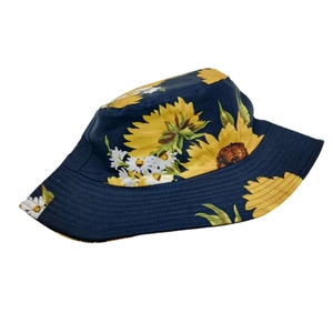 Detailed view of the sunflower print bucket hat with durable stitched brim and navy canvas fabric