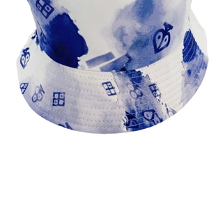 Close-up of tie-dye bucket hat with blue ink style pattern and reinforced brim stitching