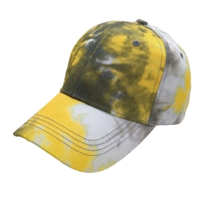 Detailed view of tie-dye baseball cap featuring yellow and grey patterns with reinforced stitching