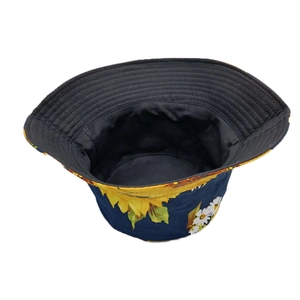 Detail view of sunflower print bucket hat with navy blue exterior and reinforced stitching