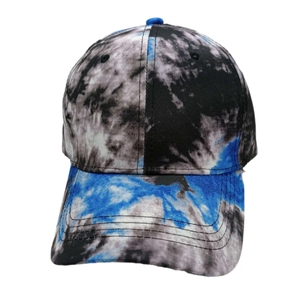 Detail of a tie-dye baseball cap featuring vibrant blue, black, and white swirl patterns