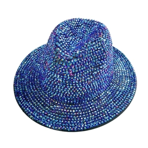 Macro detail of royal blue crystal rhinestones on a vintage wool felt fedora hat