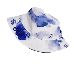 Detailed view of tie-dye bucket hat with blue ink wash pattern and stitched brim