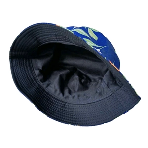 Detail of tropical floral sun hat showing navy blue plant print and reinforced brim stitching