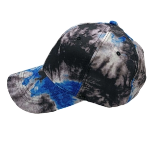 Detailed view of the multi-color tie-dye pattern and stitching on a canvas baseball cap