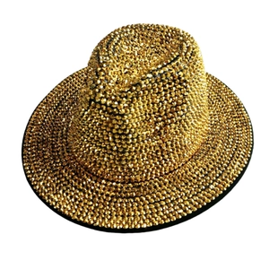 Top view of a gold fedora hat featuring dense rhinestone embellishments and a wide brim