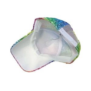 Detail view of rainbow sequin baseball cap with adjustable white snapback closure