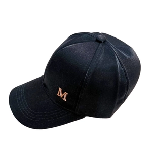 Classic black mercerized cotton baseball cap featuring a diamond-encrusted metallic M logo