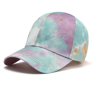 Fashionable tie-dye baseball cap in purple and blue gradient, classic 45-degree angle view