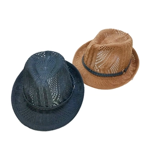 Close-up of woven straw fedora hats with breathable hollow texture and metal buckle details