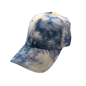 Detail view of cotton tie-dye baseball cap featuring blue and white cloud patterns