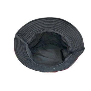 Close-up of quilted black lining and tie-dye brim detail on a stylish cotton bucket hat