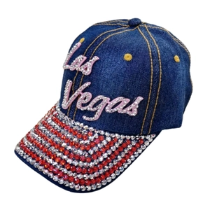 Detailed view of dark blue denim baseball cap with Las Vegas rhinestone letters