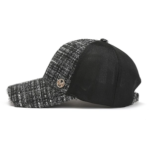 Detail of tweed mesh baseball cap with rhinestone M logo and adjustable metal buckle