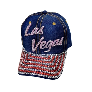 Detail of Las Vegas denim baseball cap with sparkling rhinestone stripes on the brim