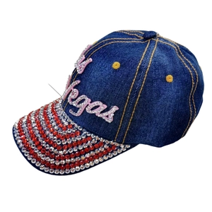 Denim baseball cap featuring Las Vegas rhinestone lettering and sparkling brim design