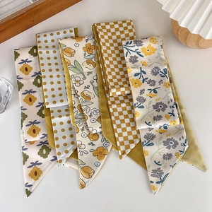 Selection of yellow floral and checkered silk scarves for hair accessories and bag straps