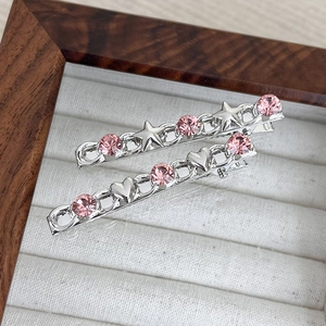 Pink rhinestone heart and star hair clips with silver alloy chain design on jewelry box