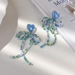 Boucles d'oreilles cœur bleu avec long pompon nœud et cristaux style sel marin