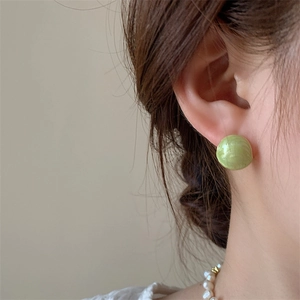 Elegant French style mint green bean stud earrings with natural shell texture for women