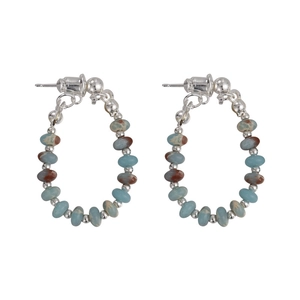 Vintage stone beaded hoop earrings with blue and reddish-brown beads on white background
