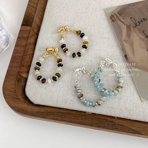 Vintage Chinese-style beaded earrings featuring elegant oval stone drops and metallic hooks