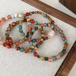 Ethnic style beaded bracelet with colorful natural stones and geometric charms