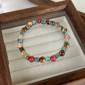 Detailed macro of vintage ethnic style bracelet with colorful geometric stone beads