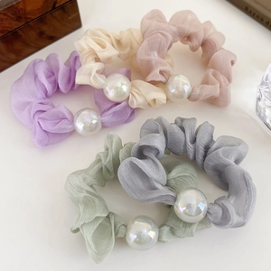 Five-piece organza scrunchie set in pastel candy colors featuring iridescent pearls