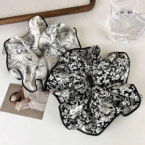 Modern ink art scrunchies set with black and white portrait and floral patterns