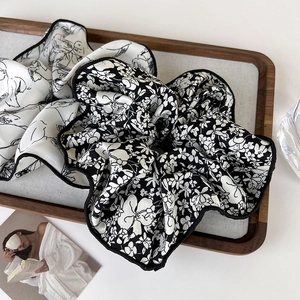 French vintage ink style fabric scrunchies with floral and minimalist portrait patterns