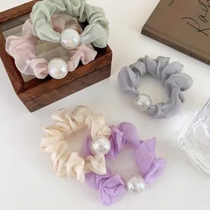 Set of pastel silk texture organza hair scrunchies with iridescent pearls for women