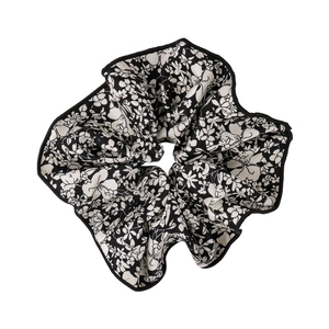 French vintage style large scrunchie with black and white floral pattern on woven fabric