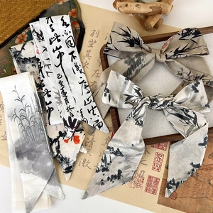 Detail of silk ribbon with Chinese ink wash bamboo painting and artistic calligraphy