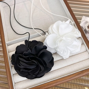 Elegant 3D fabric rose choker necklace in black and white colors with long straps