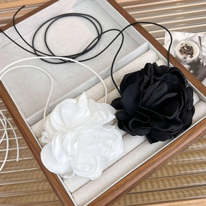 Elegant set of 3D fabric flower chokers in black and white with satin finish