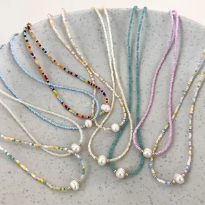Colorful handmade beaded necklace with freshwater pearl pendant and gold spacer beads
