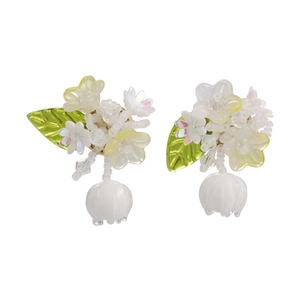 Elegant lily of the valley earrings with white flower petals and green leaf accents