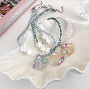 Summer beaded necklaces with star shells and colorful crystal charms in blue and purple