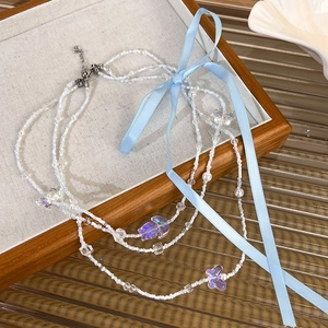 Three-layer beaded balletcore necklace with blue ribbon and purple butterfly charms
