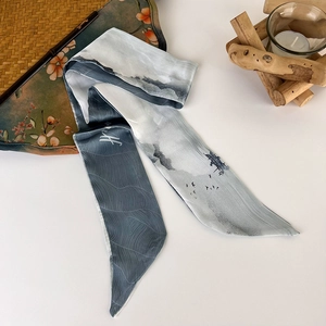 Detailed shot of a Chinoiserie style long silk scarf with ink landscape and wave pattern