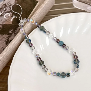 Sparkling crystal beaded phone strap with iridescent grey beads on a decorative plate
