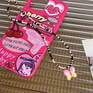 Close-up of pink Y2K phone case with BTS stickers and a butterfly beaded charm strap