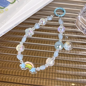 Dragonne de téléphone en perles bleues avec étoile arc-en-ciel et breloque boule cristal