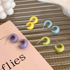 Colorful C-shaped stud earrings in macaron enamel colors with a glossy minimalist finish