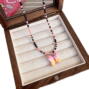 Handmade beaded necklace with pink butterfly pendant in a velvet lined jewelry box